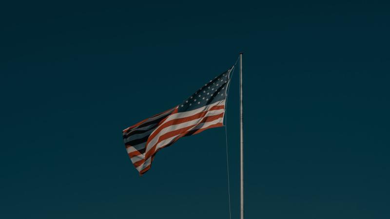 American flag with dark sky